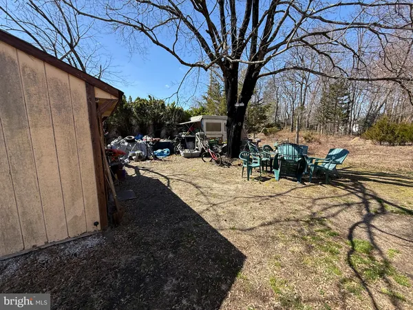 a view of a backyard of the house