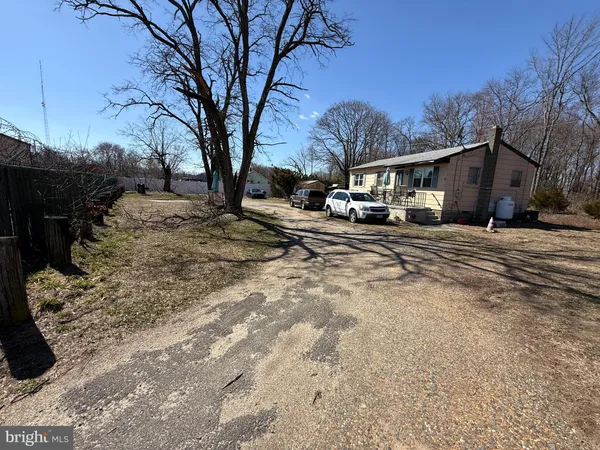 a view of a town with large trees