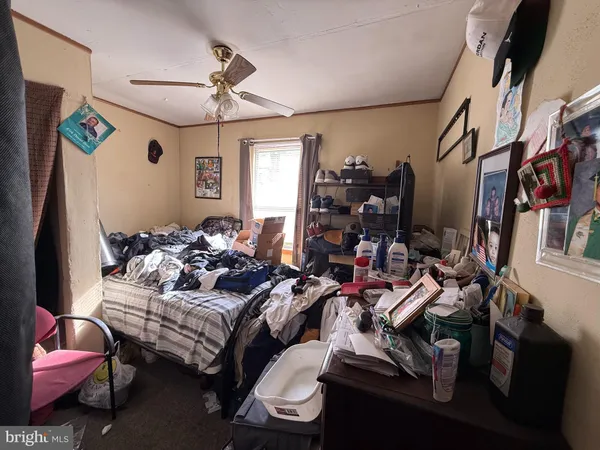 a living room with furniture chess board and a window