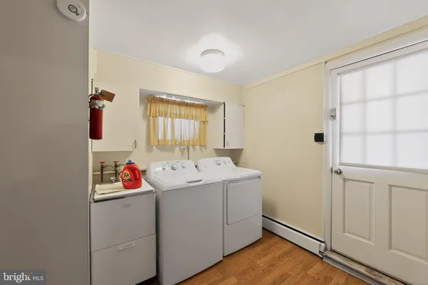 a utility room with dryer and washer