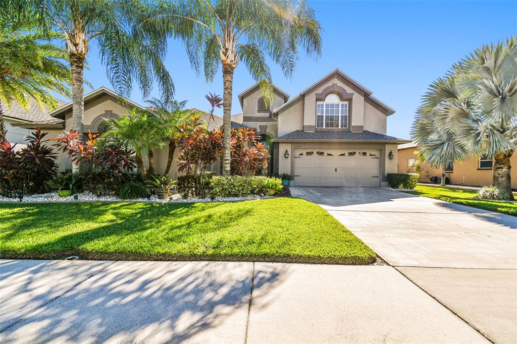 a view of front of house with a yard