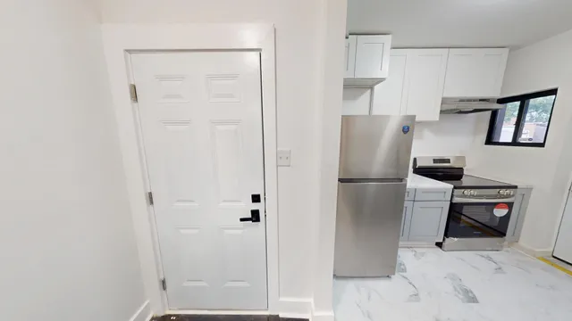 a kitchen with stainless steel appliances a refrigerator and cabinets