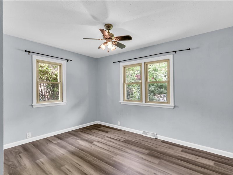 615 Breen Drive Champaign, IL 61820 - Photo 15 of 29 a view of empty room with wooden floor and fan