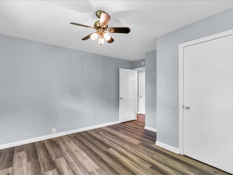 615 Breen Drive Champaign, IL 61820 - Photo 16 of 29 a view of a room with wooden floor and ceiling fan