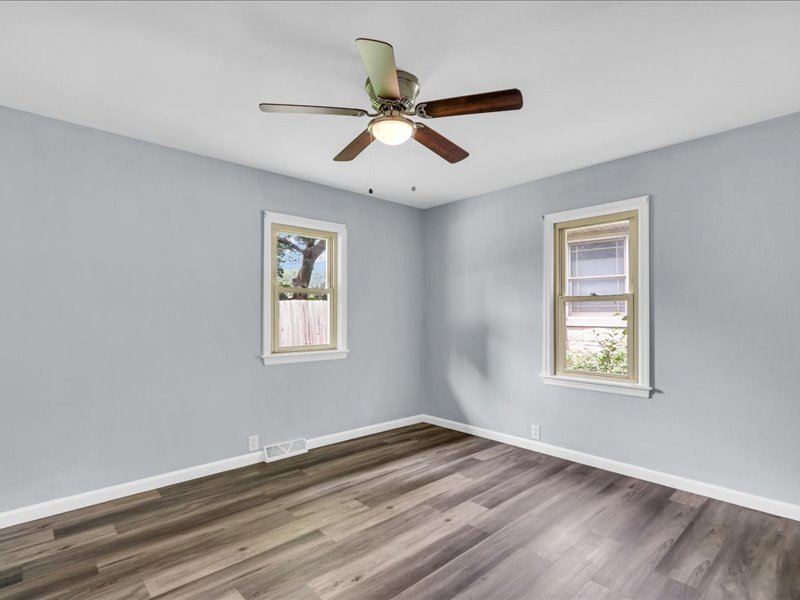 615 Breen Drive Champaign, IL 61820 - Photo 17 of 29 a view of an empty room with wooden floor and a window