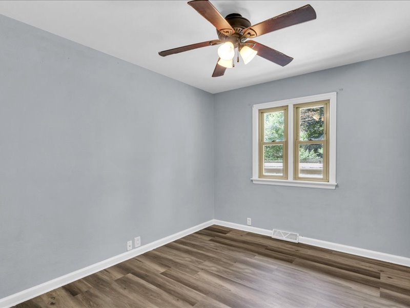 615 Breen Drive Champaign, IL 61820 - Photo 19 of 29 an empty room with a window and a fan