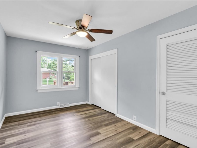 615 Breen Drive Champaign, IL 61820 - Photo 21 of 29 a view of an empty room with wooden floor and a window