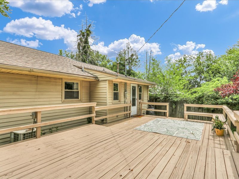615 Breen Drive Champaign, IL 61820 - Photo 25 of 29 a view of a house with a wooden deck