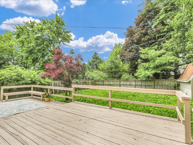 615 Breen Drive Champaign, IL 61820 - Photo 26 of 29 a view of a yard with plants and wooden fence
