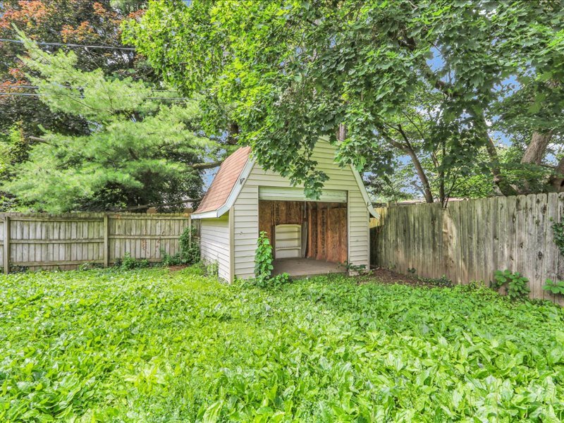 615 Breen Drive Champaign, IL 61820 - Photo 28 of 29 a view of a backyard with barn and a large tree