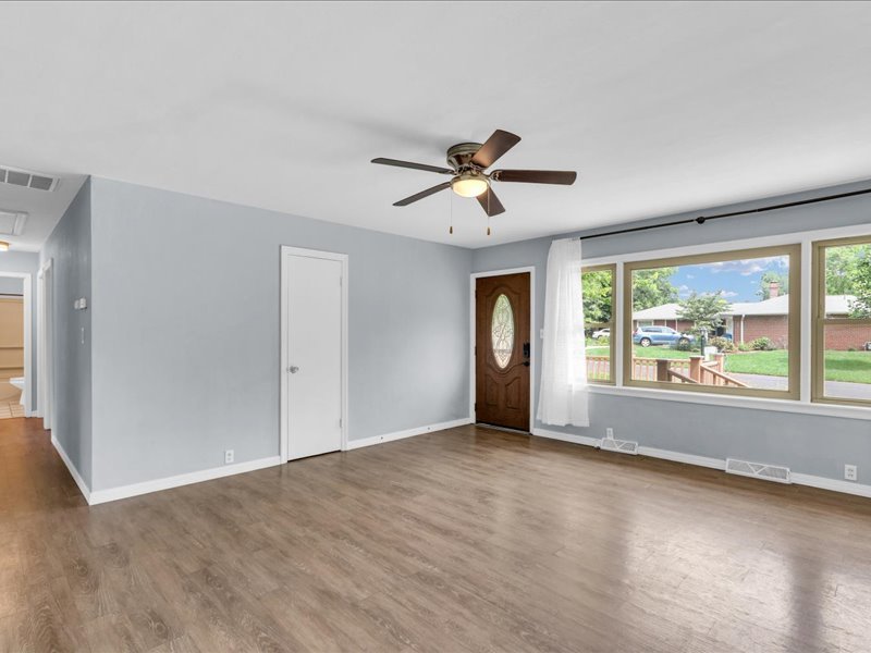 615 Breen Drive Champaign, IL 61820 - Photo 6 of 29 wooden floor in an empty room with a window