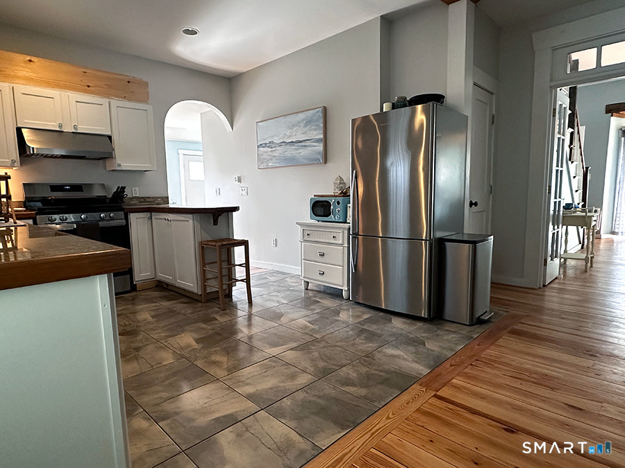 79 Wesley Avenue Westbrook, CT 06498 - Photo 11 of 33 a kitchen with stainless steel appliances granite countertop a refrigerator stove and microwave