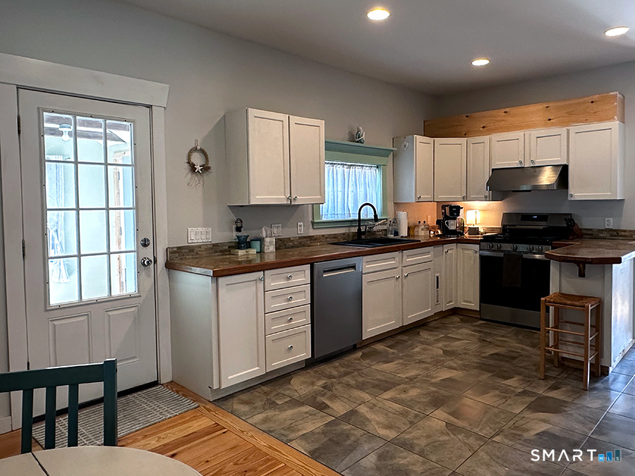 79 Wesley Avenue Westbrook, CT 06498 - Photo 12 of 33 a kitchen with granite countertop a sink cabinets and window