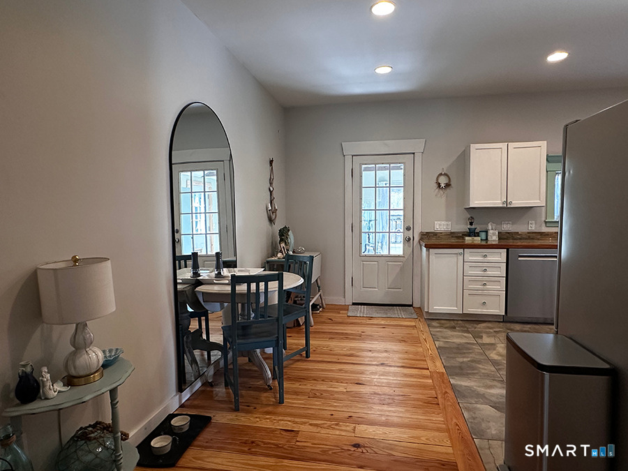 79 Wesley Avenue Westbrook, CT 06498 - Photo 13 of 33 a view of a dining room with furniture and window