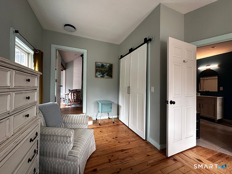 79 Wesley Avenue Westbrook, CT 06498 - Photo 17 of 33 a spacious bedroom with a bed and a refrigerator