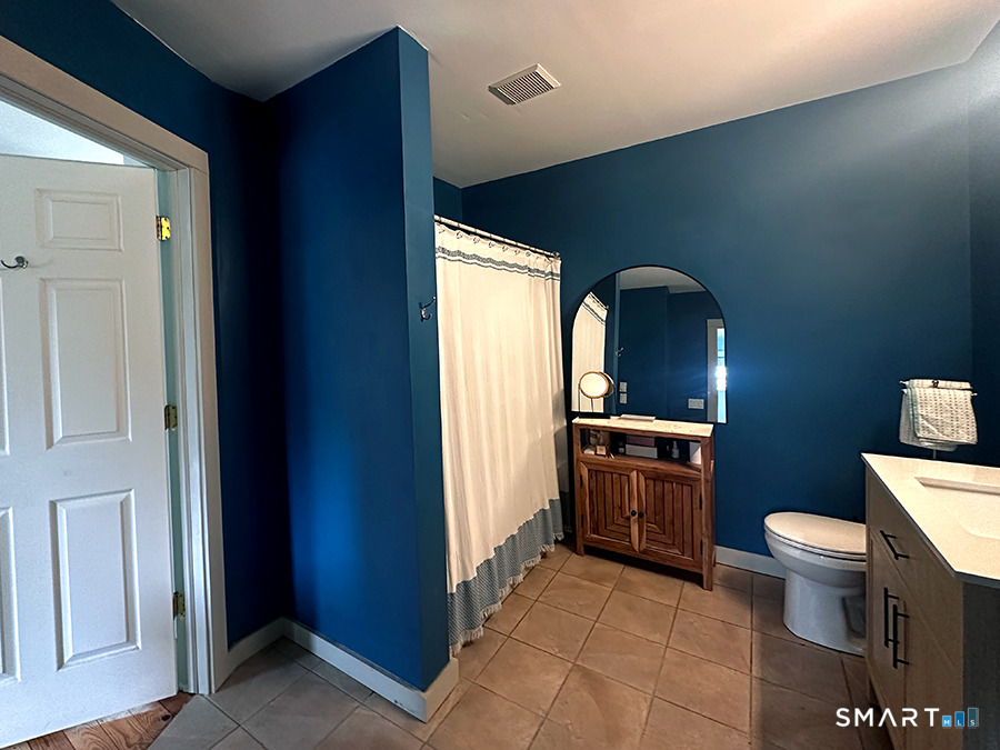 79 Wesley Avenue Westbrook, CT 06498 - Photo 20 of 33 a bathroom with a sink a toilet and granite top