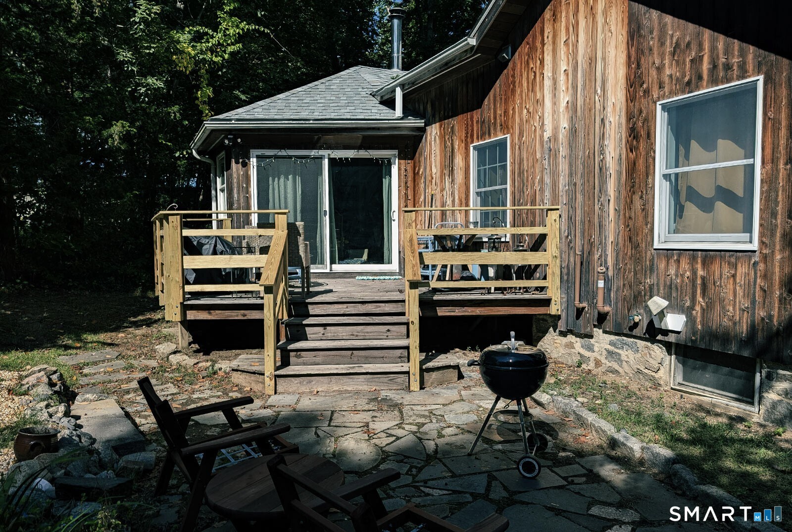 79 Wesley Avenue Westbrook, CT 06498 - Photo 2 of 33 a view of a patio with two chairs and a table