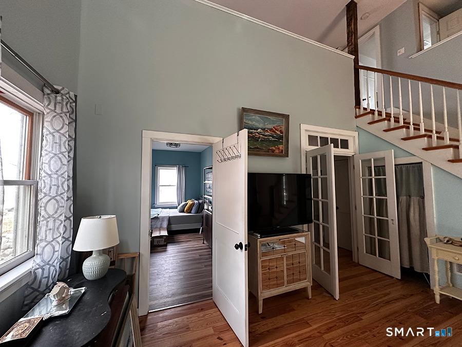 79 Wesley Avenue Westbrook, CT 06498 - Photo 21 of 33 a living room with furniture and a flat screen tv