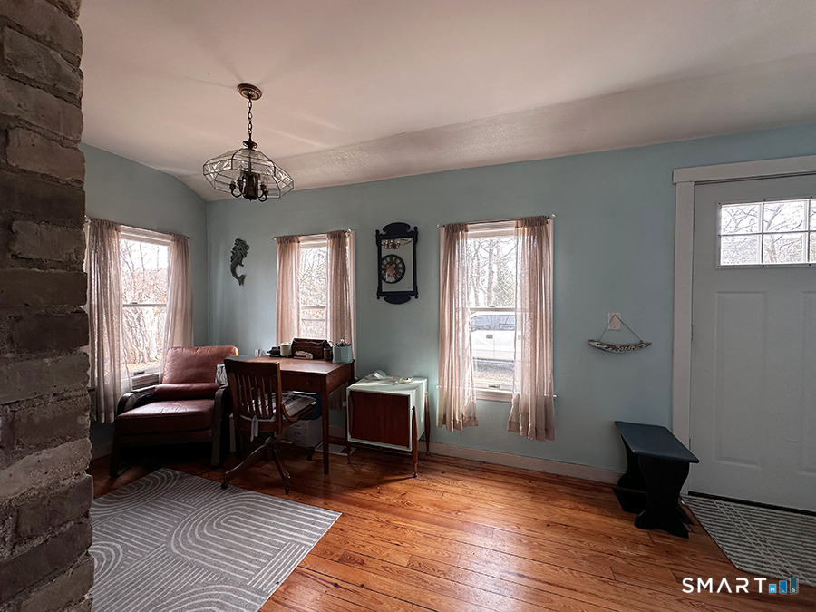 79 Wesley Avenue Westbrook, CT 06498 - Photo 25 of 33 a living room with furniture and a window