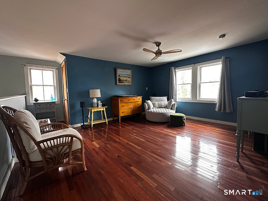 79 Wesley Avenue Westbrook, CT 06498 - Photo 28 of 33 a living room with furniture and a wooden floor