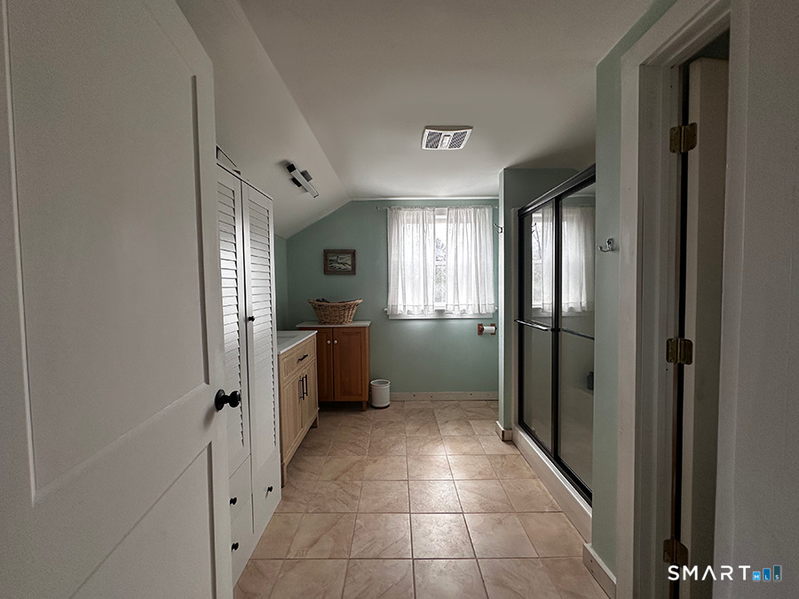 79 Wesley Avenue Westbrook, CT 06498 - Photo 29 of 33 a view of a hallway with a dining room