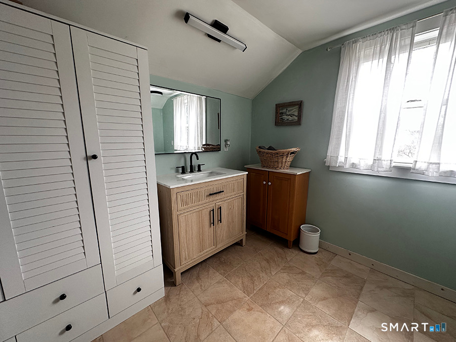 79 Wesley Avenue Westbrook, CT 06498 - Photo 30 of 33 a view of a kitchen with refrigerator and window