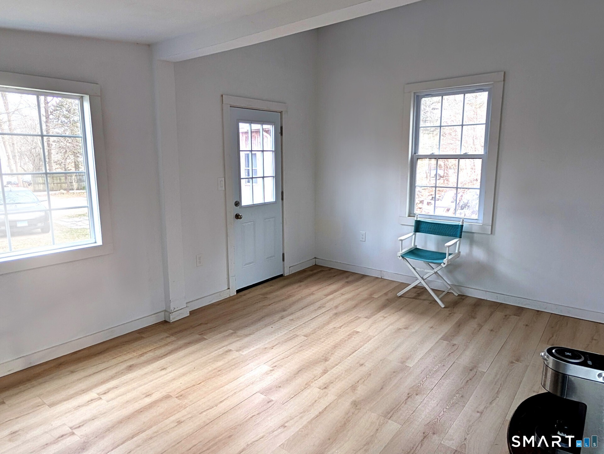 79 Wesley Avenue Westbrook, CT 06498 - Photo 32 of 33 a view of a room with wooden floor and windows