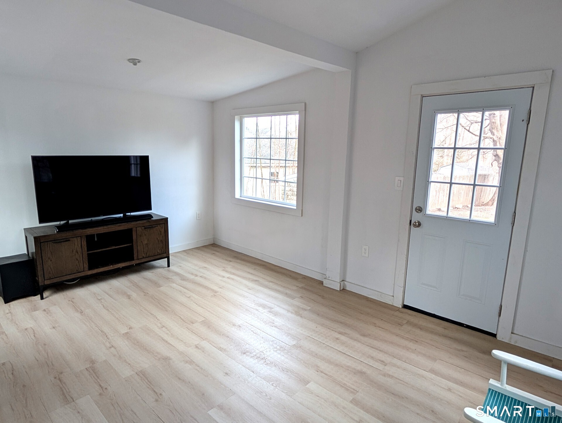 79 Wesley Avenue Westbrook, CT 06498 - Photo 33 of 33 a view of a livingroom with furniture and a flat screen tv