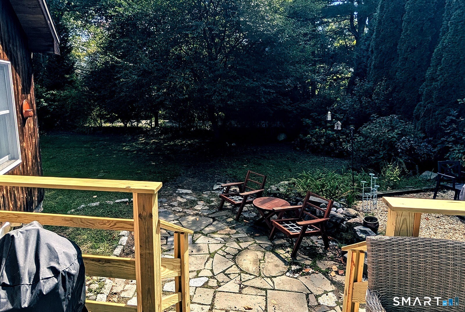 79 Wesley Avenue Westbrook, CT 06498 - Photo 5 of 33 a view of a patio with table and chairs and potted plants