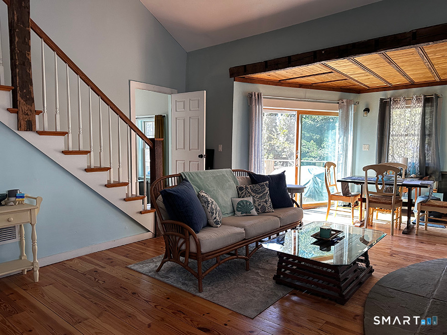 79 Wesley Avenue Westbrook, CT 06498 - Photo 6 of 33 a living room with furniture and a dining table with wooden floor