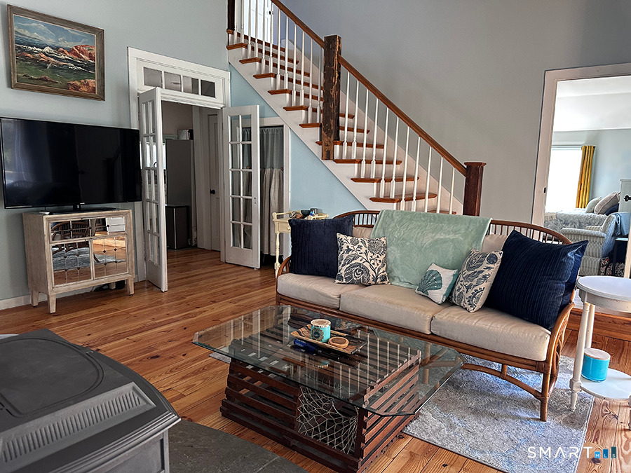 79 Wesley Avenue Westbrook, CT 06498 - Photo 7 of 33 a living room with furniture and a flat screen tv