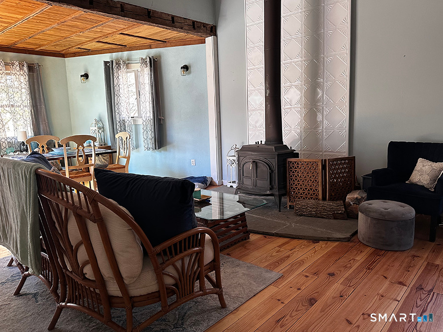 79 Wesley Avenue Westbrook, CT 06498 - Photo 9 of 33 a living room with furniture and a large window