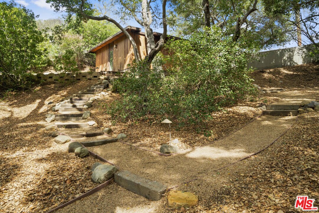 481 Cold Canyon Road Calabasas, CA 91302 - Photo 13 of 44 a view of a house with a tree