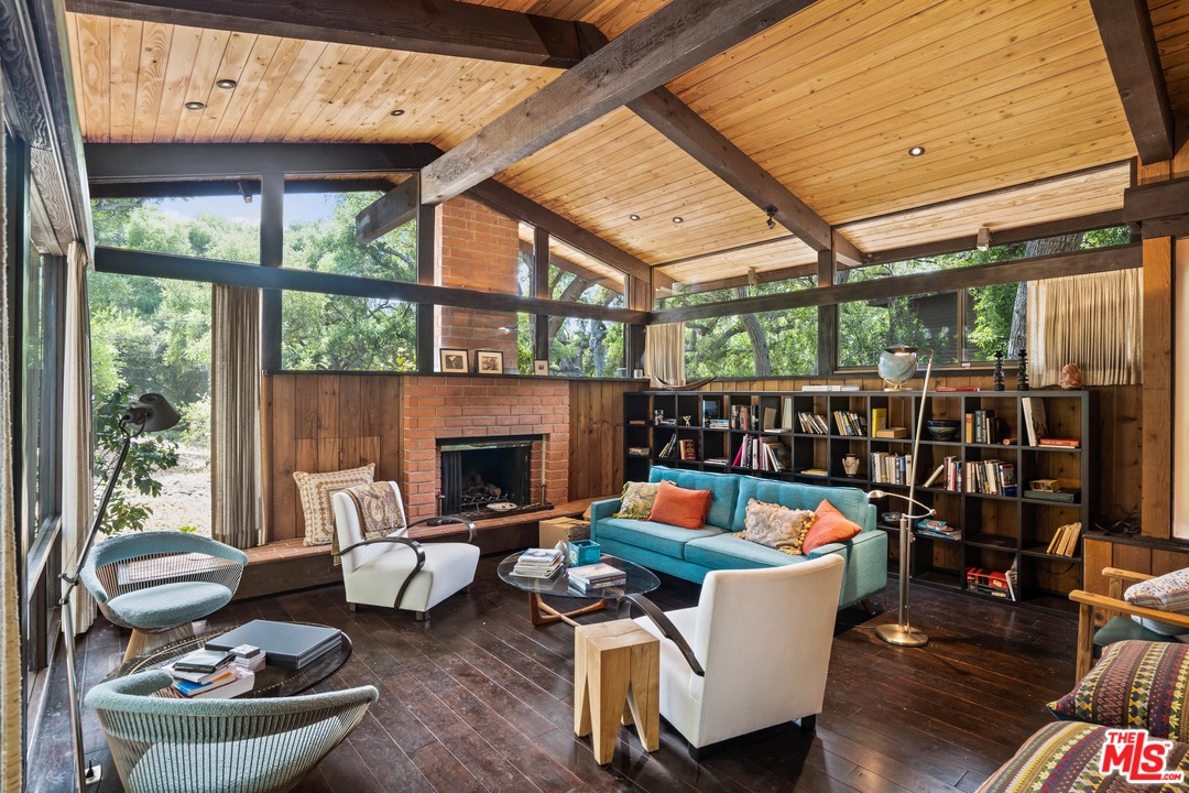 481 Cold Canyon Road Calabasas, CA 91302 - Photo 28 of 44 a living room with furniture and a fireplace
