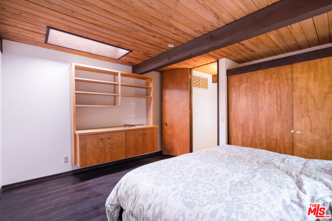 481 Cold Canyon Road Calabasas, CA 91302 - Photo 38 of 44 a bed room with a bed and a window