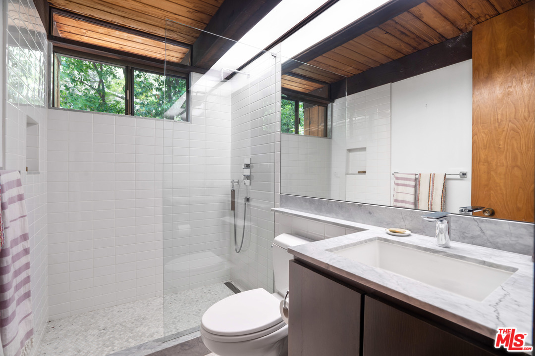 481 Cold Canyon Road Calabasas, CA 91302 - Photo 39 of 44 a bathroom with a sink a toilet and shower