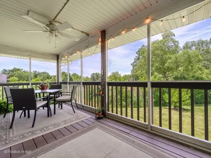 a view of a patio with a table chairs and a table