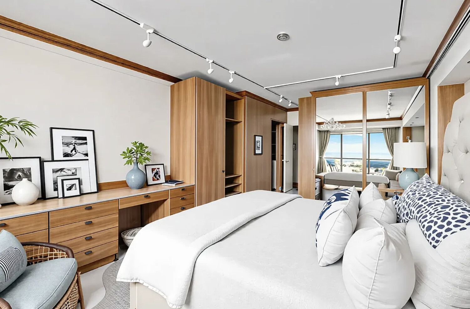 60 East End Avenue, Unit 27B Manhattan, NY 10028 - Photo 3 of 11 a bedroom with a bed large window with table and chair