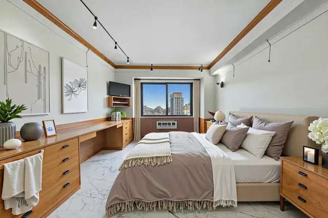 a bedroom with a bed large window with table and chair