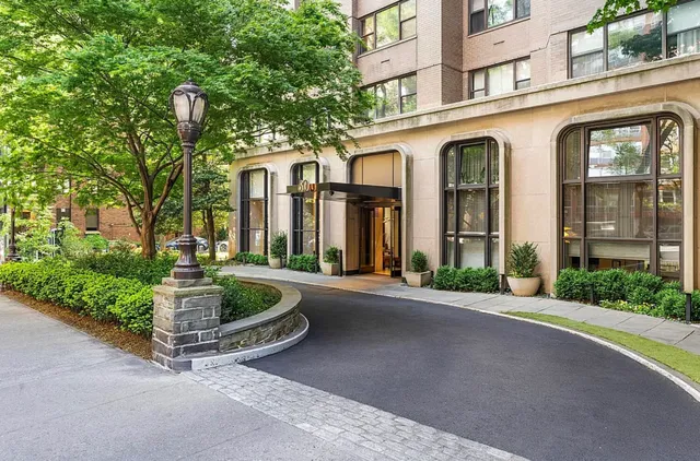 a bedroom with a bed and glass windows