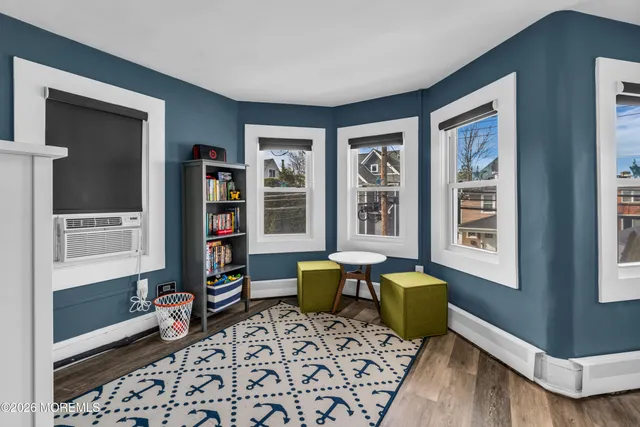 a bedroom with furniture and a window