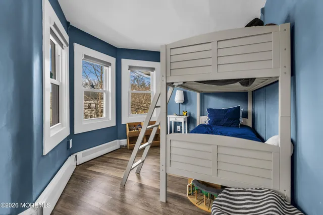 a view of living room with furniture and large window