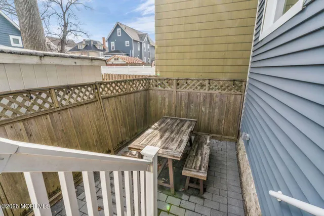 a view of balcony with furniture