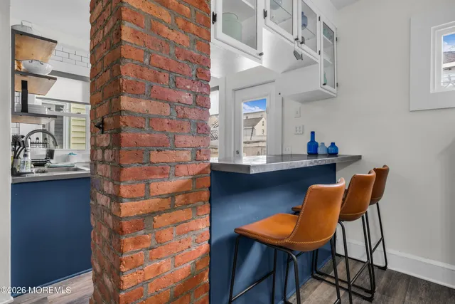 a balcony with a table and chairs