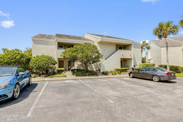 a view of a car parked in front of a house