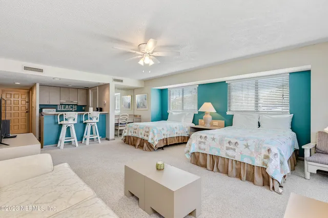 a bedroom with furniture and a chandelier