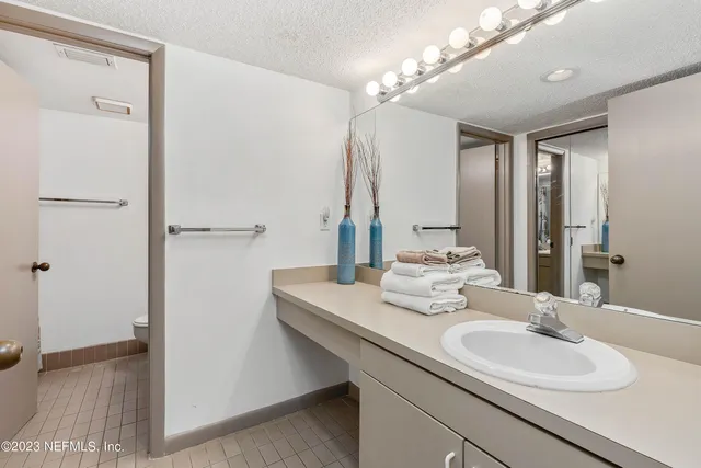 a bathroom with a sink double vanity and a mirror