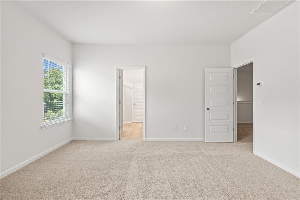 169 Andros Loop Dalton, GA 30721 - Photo 19 of 38 an empty room with windows and closet