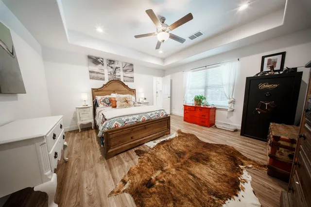 a bedroom with a bed and dresser