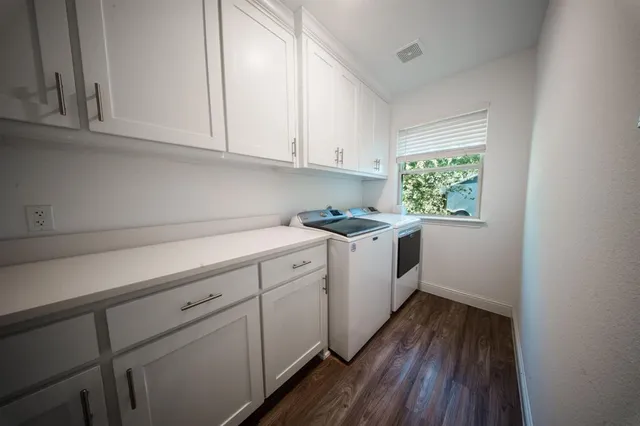 a kitchen with sink cabinets and window